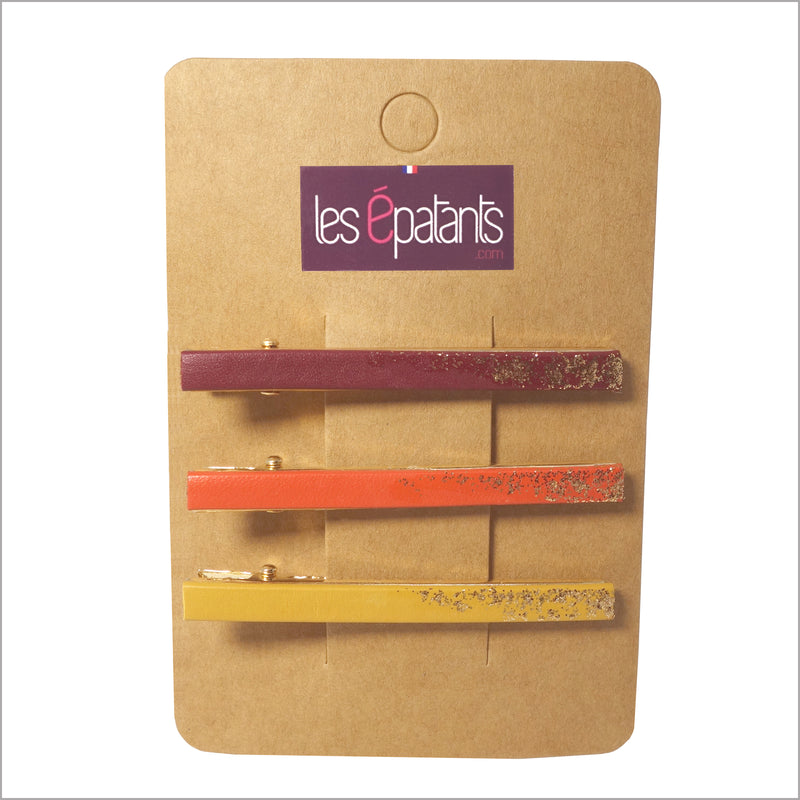 Trois pinces à cheveux en cuirs colorés et paillettes