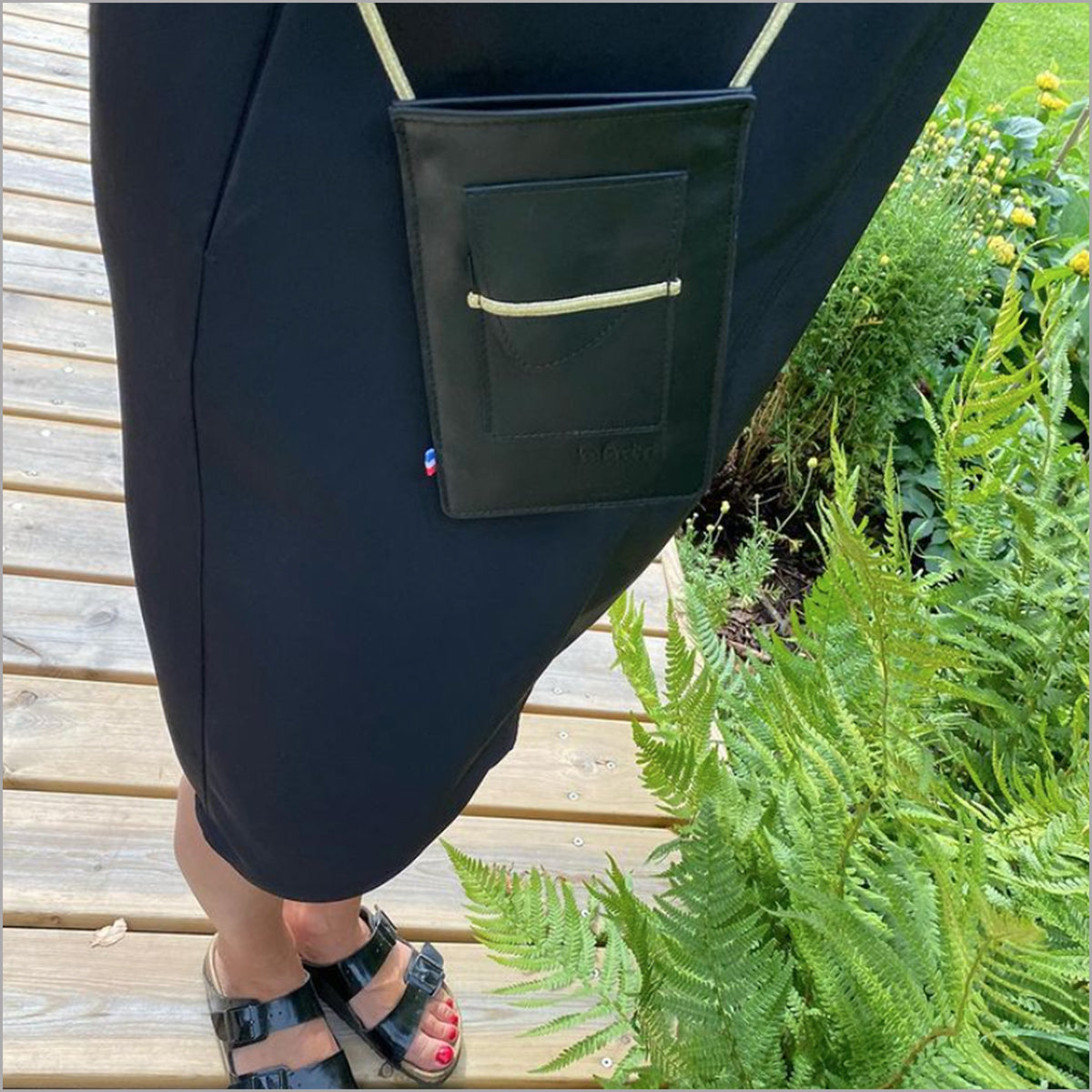 Black leather portable case with adjustable shoulder strap