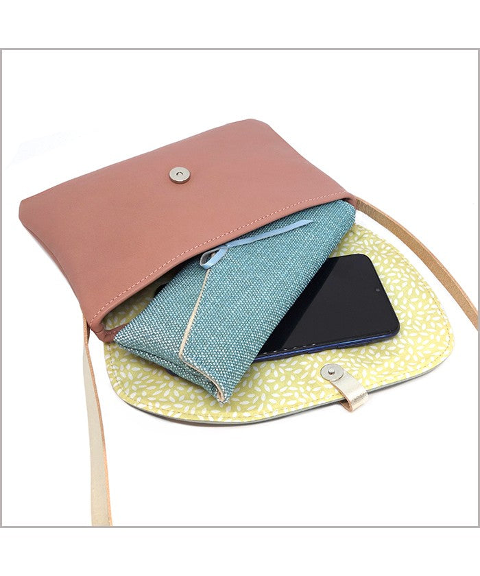 Small adjustable shoulder bag in rosewood and almond green leather
