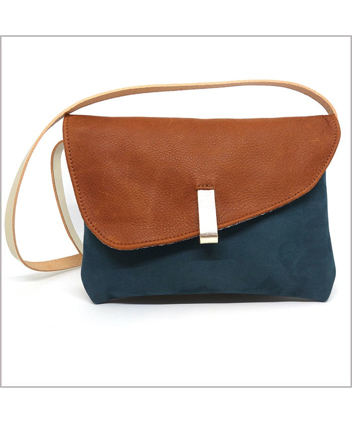 Clutch with adjustable shoulder strap in forest green and squirrel leather