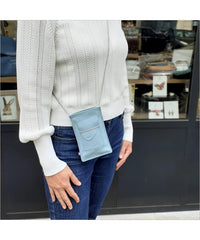 Sky blue leather portable pouch with adjustable shoulder strap